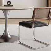 Vintage dining chair with black PU leather cushion and rattan back, single retro style